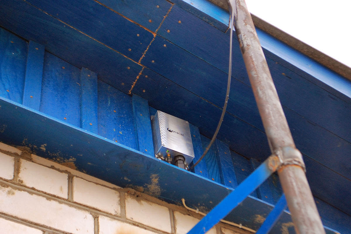 Ovi-bovi receiver on the wall under roof close to antenna